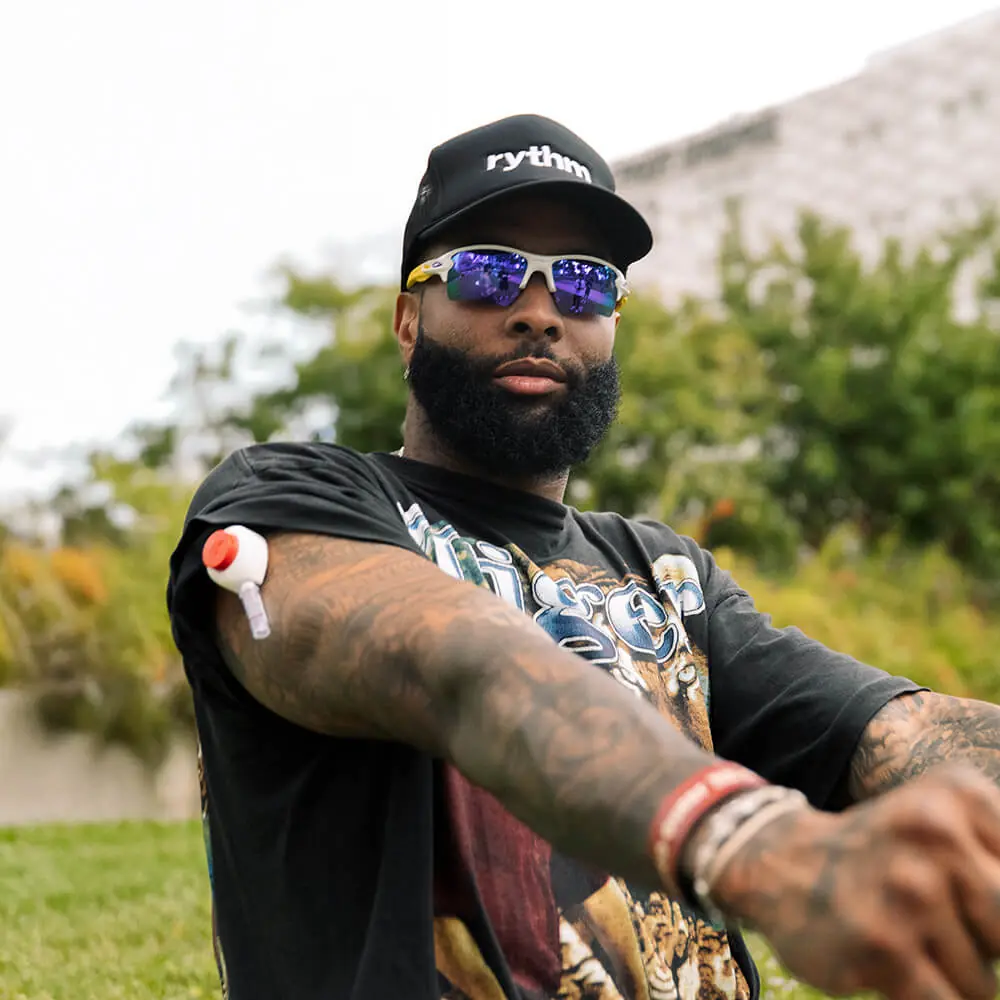 Obj outdoors wearing a Rythm Health sensor on his upper arm.
