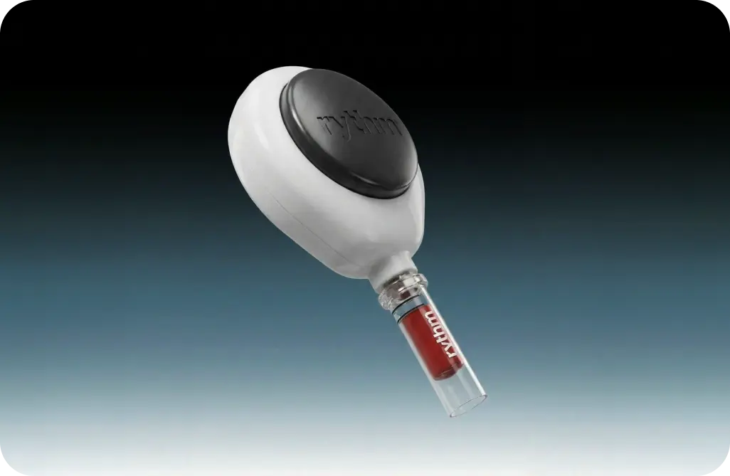 Rythm Health peptide injector device at an angle, showcasing the white applicator and red-labeled vial against a dark teal gradient.