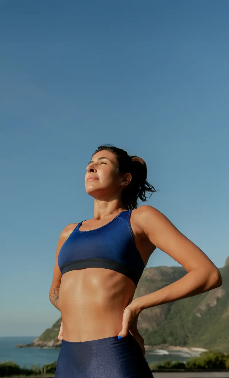 Smiling woman with clear glowing skin, doing the rythm at home blood collection representing healthy skin and internal health