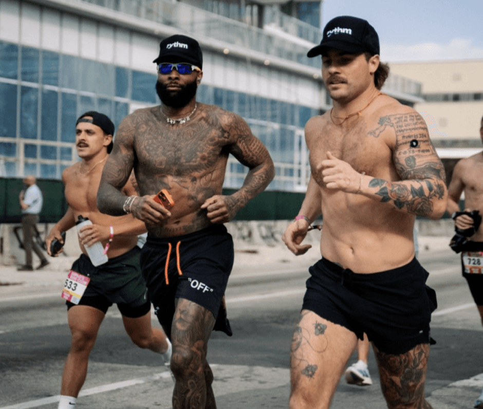 Group of men running outdoors during a race or training session.
