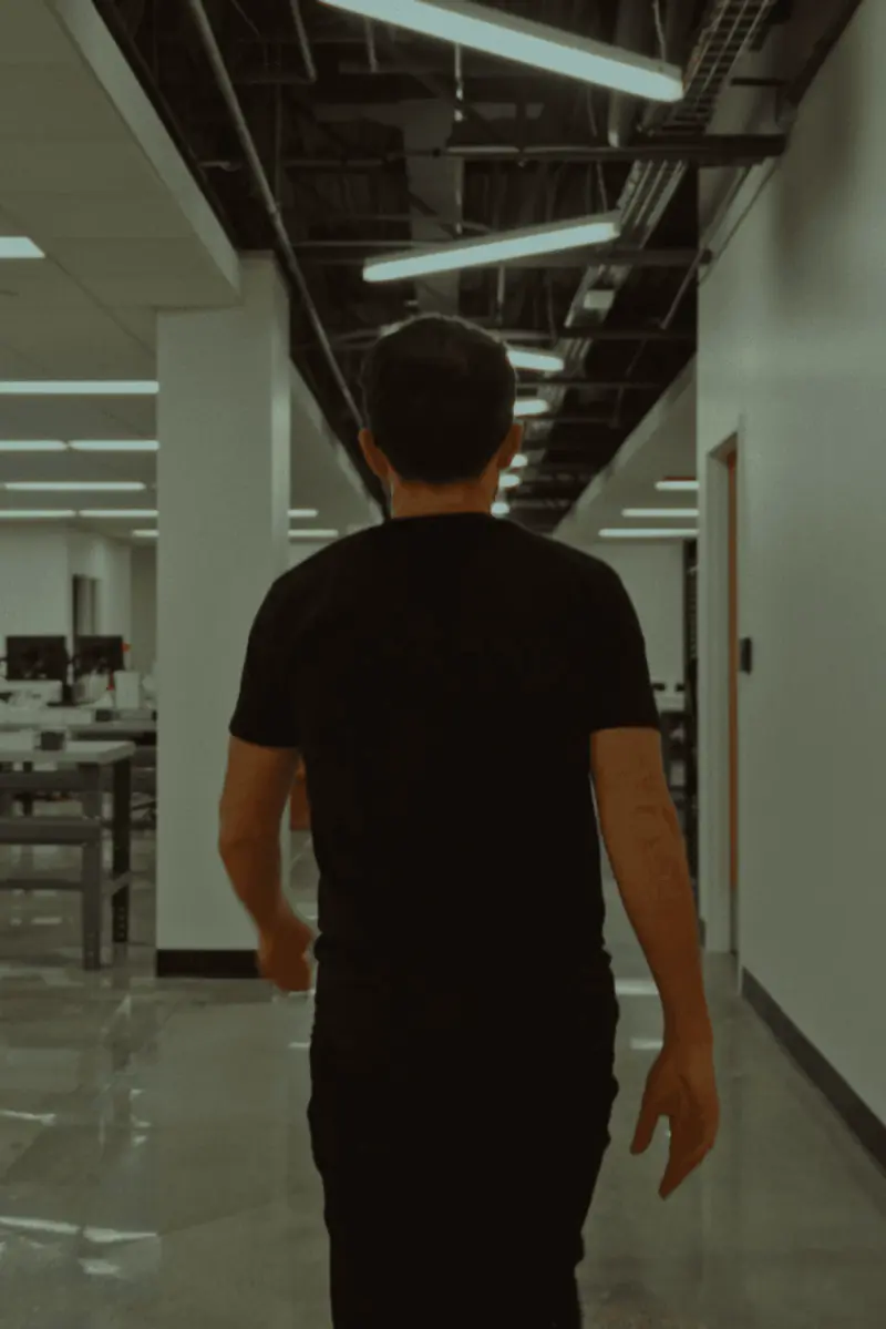 Robby Wade, CEO of Rythm Health walking through a modern laboratory workspace at Rythm Health facility.